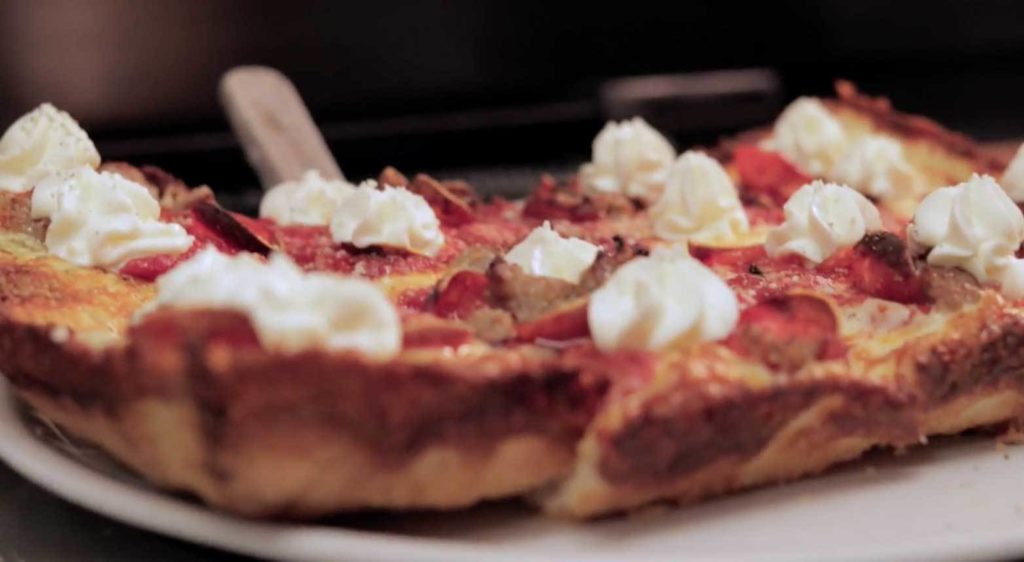Detroit-style pizza featuring dollops of Ricotta